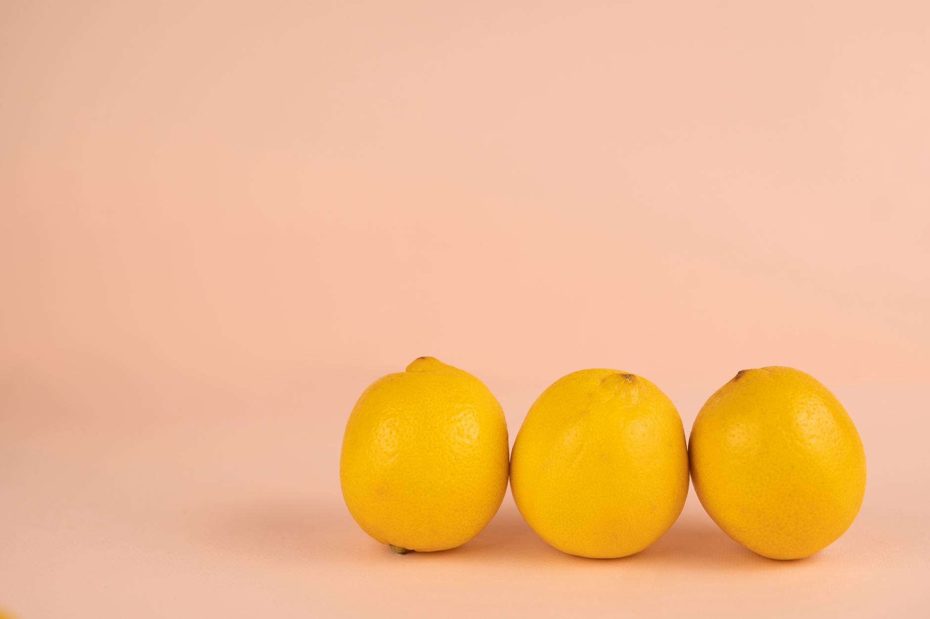 Bright ripe lemons on a pastel background representing natural aging and vitality